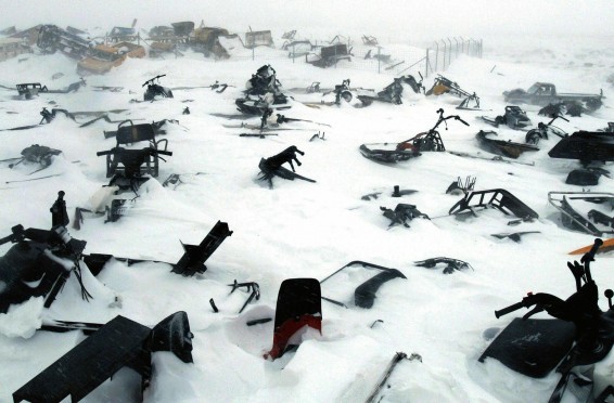 A skidoo dump/graveyard in the remote arctic village of Ivujivik, Nunavik, Quebec, Canada, April 2006.
Contact with Western societies has meant that the Inuit of arctic Canada have largely given up the use of dog sleds as their main form of transport in favour of the less environmentally friendly skidoo.
As the sea ice thins due to global warming accidents are becoming increasingly common as, unlike the team dogs who could smell salt water, the skidoo has no innate ability to know if the ice is safe to traverse.
It also serves as a reminder of the vanishing Inuit culture which, some predict, will be gone within two generations.