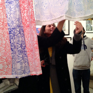 Teaching staff from William Morris Sixth Form admire the printed textiles.